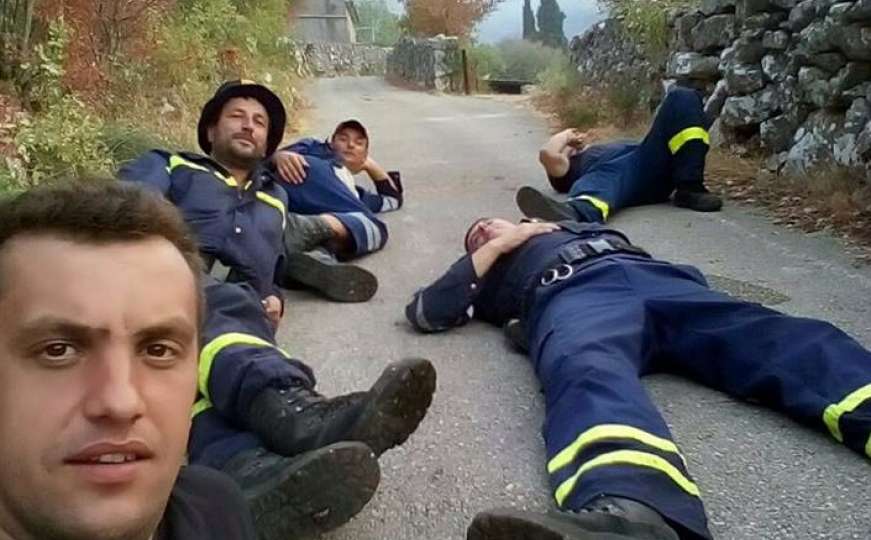 Nakon 30 sati gašenja požara: Trebinjski vatrogasci odmaraju na asfaltu