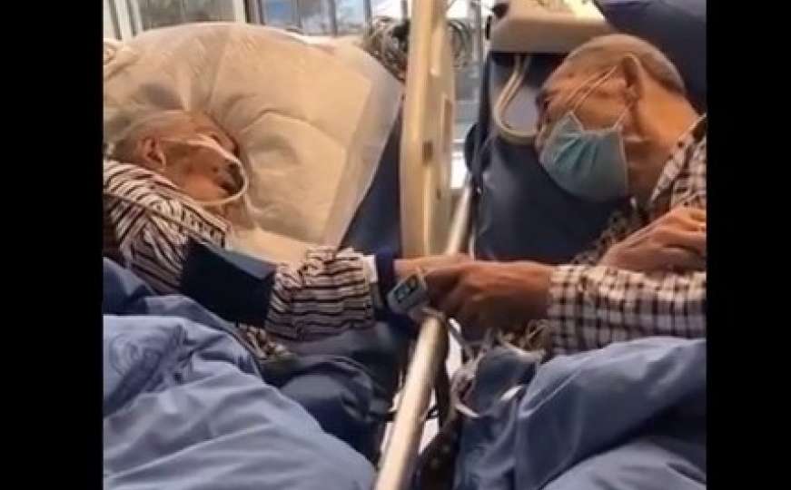 Snimka na kojoj se stariji par s koronavirusom oprašta u bolnici slama srca